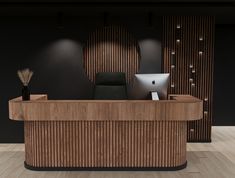 a wooden desk sitting in front of a laptop computer