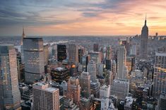 an aerial view of new york city at sunset