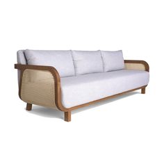 a white couch sitting on top of a wooden frame