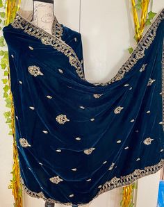 It is a beautiful shawl for women. It is a full big size shawl . It is embroided with zari thread,sequence work on it. It's length is 3 yards and width 1 yard. Very beautiful and soft velvet. Available in zinc blue color  No return or exchange please . New design. very light weight shawl. Festive Velvet Dupatta With Pallu, Velvet Saree With Zari Work And Traditional Drape, Velvet Saree With Traditional Drape And Pallu Detail, Velvet Dupatta With Pallu For Eid, Velvet Saree With Pallu In Traditional Drape, Bollywood Style Velvet Dupatta For Diwali, Bollywood Velvet Dupatta For Diwali, Velvet Dupatta For Eid Party, Velvet Dupatta With Dabka Work For Parties