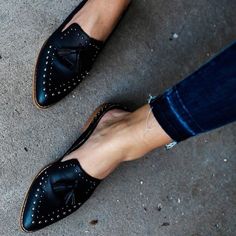 Black studs tassel flat mule loafers for women, a perfect blend of style and comfort. These chic loafers feature a striking tassel design accented with studs, offering trendy appeal and all-day wearability. Whether for casual outings or semi-formal events, these versatile flats provide a fashionable edge to any outfit. Crafted for durability and convenience with their slip-on style, these loafers are a must-have addition to your shoe collection. Handcrafted US sizing. Fits true to size. Chic Tassel Design: Black stud-adorned fringe detailing for a trendy, fashionable look. Comfortable Flats: Flat mule loafers ensure all-day comfort without compromising style. Versatile Style: Perfect for casual or semi-formal occasions, offering adaptability to various outfits. Durable Construction: Crafte Mule Loafers, Black Studs, Fashion Formal, Business Casual Shoes, Outfits Classy, Women Heels, Christian Fashion, Women Business, Studded Flats