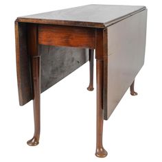 an old wooden desk with metal top and legs