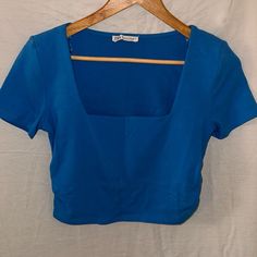 Zara Cropped T-Shirt. Ruched Sides To Be More Cropped. Bright Blue. Never Worn, Like-New Condition Zara Fitted Short Sleeve Top, Fitted Blue T-shirt For Summer, Blue Stretch Short Sleeve Top For Summer, Stretch Blue Short Sleeve Top For Summer, Blue Fitted T-shirt For Summer, Zara Blue Fitted Crop Top, Zara Fitted Short Sleeve Crop Top, Trendy Light Blue Zara Tops, Blue Fitted Cotton Top