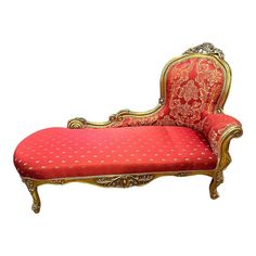 an ornately decorated chaise lounge with red and gold upholstered fabric on it