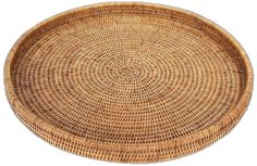 a round woven wicker tray on a white background