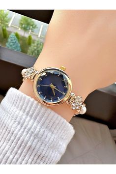 Elevate your style with our stunning Pearl Bead Embroidered Stone Vintage Women's Wristwatch, a perfect blend of elegance and sophistication. This exquisite timepiece is designed for the modern woman who appreciates classic beauty with a contemporary twist. Features: Case Diameter: 26-30mm for a comfortable fit on any wrist. Case Material: Crafted from durable metal, ensuring longevity and a timeless appeal. Cord Material: The robust metal cord adds a touch of glamour, making it ideal for both everyday wear and special occasions. This vintage watch is adorned with intricate pearl bead embroidery and sparkling stones, making it a striking addition to any jewelry collection. Whether you're celebrating a birthday, looking for a unique Halloween gift, or simply treating yourself, this stoned w Watch On Wrist, Women Birthday, Unique Halloween, Women Wrist Watch, Bead Embroidery, Classic Beauty, Wrist Watches, Halloween Gift, Gift For Women