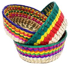 three different colored baskets sitting next to each other