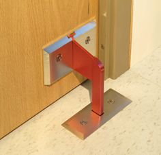 an open door with a red handle on it