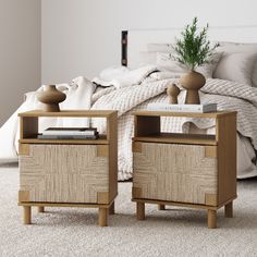 two nightstands with books on top of them in front of a bed and pillows