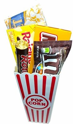 a popcorn bucket filled with snacks and candy