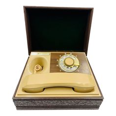 an old fashioned phone in a wooden box