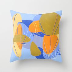 a blue and yellow pillow with an image of hot air balloons floating in the sky