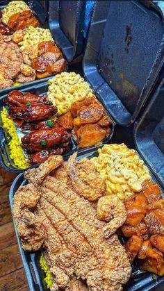 several trays filled with different types of food