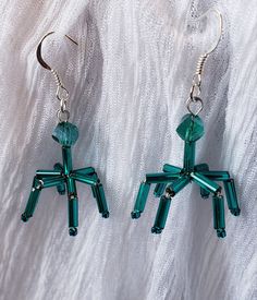 These Earrings are an artistic representation of a Virus. They are made of glass beads, teal in color. They measure 1 inch long by .75 of an inch wide. The earring posts are silver plated. (If you require stainless steel posts, please message me for details.) Very Cute and Nerdy. Available in different colors! If you would like to order multiples of this listing, message me for details. Thank you for shopping with me! Follow me on Instagram for coupon codes, new inventory, and sales! @biolojewel Science Earrings, Biology Science, Science Biology, Earring Posts, Biology, Post Earrings, Coupon Codes, Beaded Earrings, Turquoise Necklace