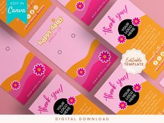 several pink and orange business cards with flowers on them