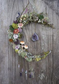 a wreath made out of flowers and moss