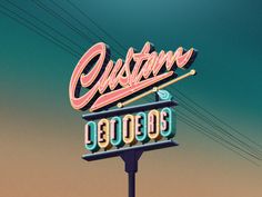 an old neon sign for a restaurant called custom 80009872, with power lines in the background