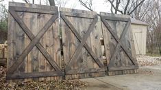 three wooden gates are stacked on top of each other