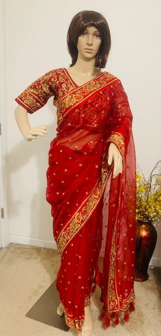 Product code-SA35 Muslin Red designer bridal Saree for Women Fancy Party Wear.Heavy zari embroidery , hand work saree with stitched embroidered Red half sleeve Blouse Falls,Picu, piping tassel work nicely done  * Saree Length: - 5.6 Meter * Blouse- stitched size 38-40  * Blouse is stitched. Saree colour-Red * Saree Comes with stitched Blouse Red Pre-draped Saree With Dupatta For Reception, Bollywood Style Red Pre-draped Saree For Reception, Bollywood Red Pre-draped Saree For Reception, Traditional Red Pre-draped Embroidered Saree, Traditional Red Embroidered Pre-draped Saree, Traditional Red Pre-draped Saree With Resham Embroidery, Red Sharara For Puja And Transitional Season, Festive Red Pre-draped Saree With Pallu, Red Dola Silk Pre-draped Saree With Dupatta