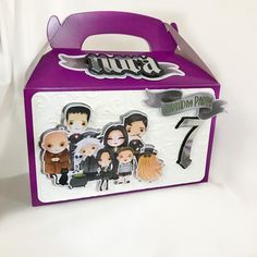 a purple and white box with some stickers on it