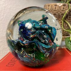 there is a glass ball that has been made to look like waves