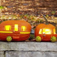 two carved pumpkins sitting next to each other