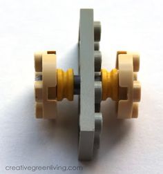 a close up of a lego toy with two wheels