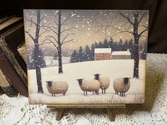 a painting of sheep standing in the snow