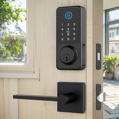 an electronic door lock on a wooden door with a brick walkway in front of it