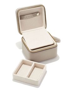 an open box with two compartments on the inside and one in the outside, sitting next to it