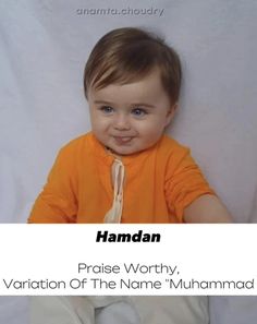 there is a small child smiling with the name hamdan on it's chest