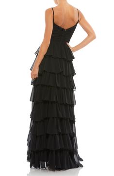 Assert the ravishingly obvious in a captivating tulle gown that proves you can never have too many rows of ruffles on a special night out. 62 1/2" length (size 4) Hidden back-zip closure Surplice V-neck Sleeveless Side slit Lined 100% polyester Spot clean Imported Asian Owned/Founded Skirt And Thigh Highs, Ruffle Gown, Unique Prom Dresses, Sleeveless Gown, Designer Prom Dresses, Prom Designs, Ruffled Skirt, Tulle Gown, Mac Duggal