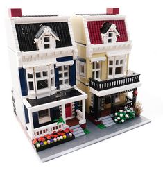 two lego houses are shown in front of each other