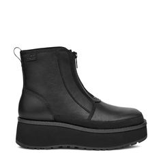 Explore urban adventures in luxurious style with these women's Ugg Cityfunc black winter boots. Featuring water-resistant leather upper, these round toe boots have rear pull tab made from 100% recycled polyester fibers for sustainability and front zipper closure for easy wear and a secure fit. Textile lining made of 49% polyester and 51% UNIFI REPREVE recycled polyester, molded EVA footbed, and peppermint-based anti-odor treated sockliner keep your feet comfortable and fresh all day long. Lightweight sugarcane EVA midsole and lugged, durable rubber outsole provide excellent support and grip. Wedge heel and platform elevate the appeal. | Ugg Women's Cityfunc Winter Boot in Black Size 7. 5 Medium Ugg Zipper Boots, Ugg Leather Boots For Women, Women’s Winter Boots, Winter Combat Boots, Ugg Style Boots, Round Toe Boots, Black Winter Boots, Ugg Style, Toe Boots