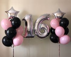 balloons and streamers are arranged in the shape of the number sixteen, with stars on them