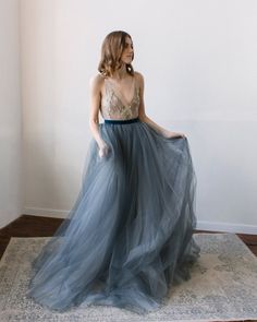 This a fancy tulle wedding skirt with a long train, elegant and airy. The skirt consists of several layers of silk, chiffon, and tulle. It is fastened on the back with a concealed zipper and velvet belt. If you want to change any detail in the style of the wedding skirt, just email us. We will discuss everything and make a custom skirt for you. All our skirt are made to order. Rush orders: Please contact us if your situation requires shorter production times; we will do our best to help you. Siz Dark Blue Wedding Dress Tulle & Chantilly, Luxury Tulle Skirt Dress For Romantic Evening, Luxury Tulle Dress With Tulle Skirt, Luxury Wedding Maxi Dress With Tulle Skirt, Dusty Blue Wedding Dress Tulle Skirts, Luxury Organza Evening Dress With Tulle Skirt, Luxury Wedding Skirt For Summer, Luxury Formal Evening Dress With Tulle Skirt, Luxury Full Skirt Bridesmaid Dress