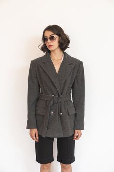 This wool jacket is crafted from raw herringbone wool, offering a relaxed fit with a timeless style. It features a classic collar with wide lapels, long set-in sleeves, and front flap pockets for practicality. The coat fastens with two buttons, providing an elegant touch while allowing enough room for layering oversized sweatshirts and sweaters underneath. Its comfortable yet structured design ensures freedom of movement, making it a versatile and cozy choice for the cooler autumn days. Model measurements: Height - 175 cm (5'9"ft) Bust - 82 cm (32.3 in) Waist - 61 cm (24 in) Hips - 92 cm (36.2 in) 🧶Details 40% Wool, 40% Cotton, 20% Polyester Lining: Viscose Model wears a size S 📏Product Size Chart: XS (US 2) 1/2 Bust - 50.5 cm | 19.9 in 1/2 Hip - 52 cm | 20.4 in Back Length - 75 cm | 29. Structured Design, Straight Jacket, Grey Herringbone, Short Women, Autumn Days, Red Coat, Oversized Sweatshirt, Wool Jacket, Gray Jacket