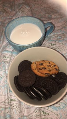 cookies and milk are in a bowl on a table