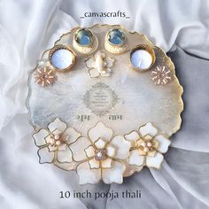 an image of a plate with flowers and jewels on it's side that says canvascrafs