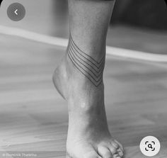 black and white photograph of a person's foot with lines on it, in the middle of their left leg