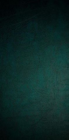 an image of a dark green background that looks like it could be used as a wallpaper