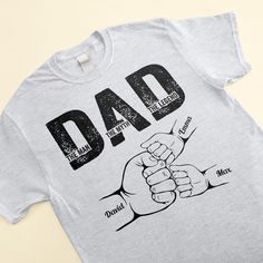 Treat your favorite guy to a custom shirt just for him! This unique gift is perfect for Father's Day, birthdays, or any time you want to make dad feel extra special. This customized t-shirt will become his new go-to for weekend wear, sports games, barbecues, or any casual occasion. The unique personalization makes it feel one-of-a-kind. A personalized shirt is a thoughtful, unique gift idea for dads of all ages. It shows Dad you put time and thought into finding him the perfect present. Plus, th Unique Shirts Design, Mom Daughter Gifts, Canvas Beach Bag, Leather Flask, Family Design, Shirt Designs For Men, Custom Design Shirts, Father's Day T Shirts, Customise T Shirt