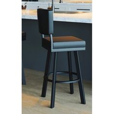 a bar stool in front of a kitchen counter