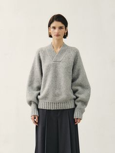 Editor's NotesMohan is a compound word that means MODERATION HANDLING - dealing with moderation. Mohan's basic philosophy is Maximize Minimal. It expresses the feminine neutral aspect in a calm and restrained design based on classical elements. We prioritize communication of various thoughts based on a broad spectrum of research rather than personal inspiration and intuition.- This is a cozy V-neck knit sweater made from a blend of alpaca and wool materials. - It provides a warm feeling, thanks to the use of long-fibered yarn, making it suitable for wearing even in the coldest winter months. - The thick yarn and oversized silhouette allow for comfortable wear. - This product is available in two sizes: S and M.Measurements(in.)Size: One size ( XS - M )- Shoulder:35.83/36.22  in.- Chest Knitwear Fashion Design, Modern Knitwear, Thick Yarn, Thick Sweaters, Knitwear Fashion, Sweater Making, Sweater Fashion, Cotton Sweater, Vneck Sweater