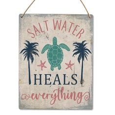 a sign that says salt water heals everything with a sea turtle and palm trees