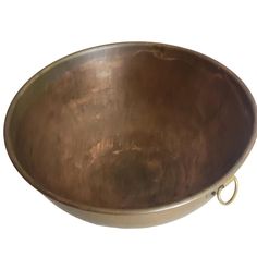 a large metal bowl on a white background