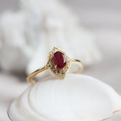 Oval Cut Ruby Wedding Ring, Women's Gold Bridal Ring, Delicate Art Deco Bridesmaid Jewelry, July Birthstone, Promised & Statement Gift Ring Maine Stone - Ruby ( Lab Created ) Stone Shape - Oval Stone Color -Red Stone Size -8x6 mm Birthstone - June Secondary Stone : CZ Diamond Stone Shape: Round Stone Color: Colorless Features: * Handmade * Ready To Ship * Brand New * All Ring Sizes Available * Suitable For Every Day * 14k Solid Gold / 18k Solid Gold / Gold Filled Over Sterling Silver * Purity St Red Halo Jewelry For Wedding, Wedding Ruby Birthstone Ring Round Shape, Round Ruby Wedding Birthstone Ring, Heirloom Style Ruby Gemstone Ring For Wedding, Wedding Ruby Ring With Center Stone, Heirloom Style Ruby Ring For Wedding, Wedding Ruby Jewelry With Halo Setting, Ruby Jewelry With Halo Setting For Wedding, Dainty Ruby Birthstone Ring For Wedding