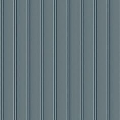 a blue wall with vertical lines on it's sides and the bottom half painted gray