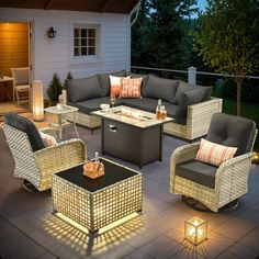 an outdoor patio with wicker furniture and lights