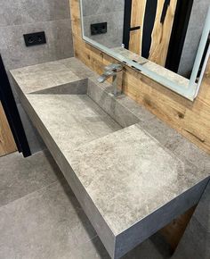 a bathroom with a sink and mirror in it